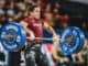 A CrossFit Athlete performs a clean (an Olympic lift) during an event at the CrossFit Games 2019.