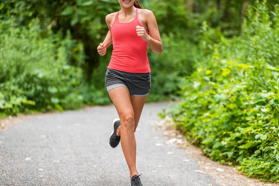 Woman in workout shorts during her running workout.