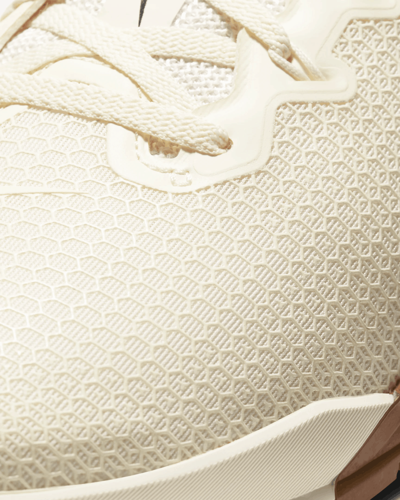 Mesh upper closeup of the Nike Metcon 5 Cross Trainer for CrossFit in Pale Ivory/Seaweed/Light British Tan/Black