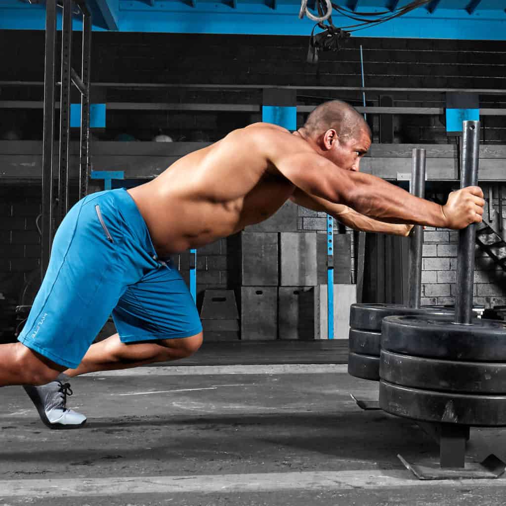 Sled push in the Men's workout shorts for CrossFit - Helix II from Hylete in Agean/Agean