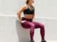 Wall squat with the Hylete Motiv II Vent Workout Tights in Galaxy Plum