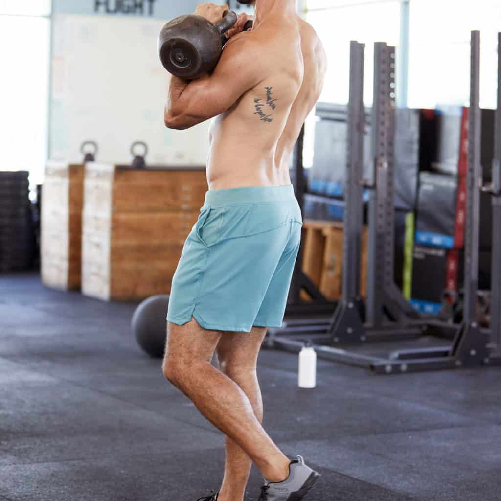 KB exercises with the Fuse Men's Workout Shorts for CrossFit from Hylete in Heather Trellis/Trellis color