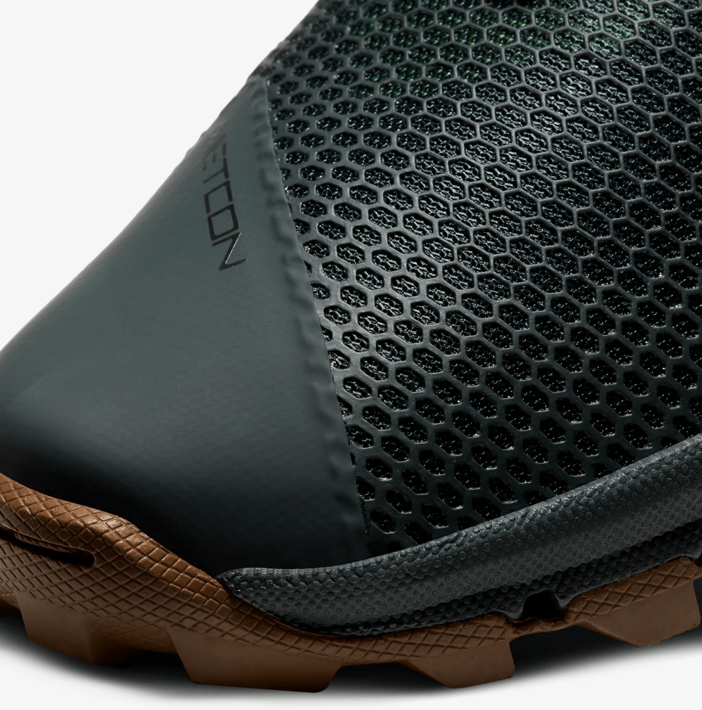 Mesh upper closeup of the Nike MetconSF shown here in Seaweed/Light British Tan/Green Spark/Black