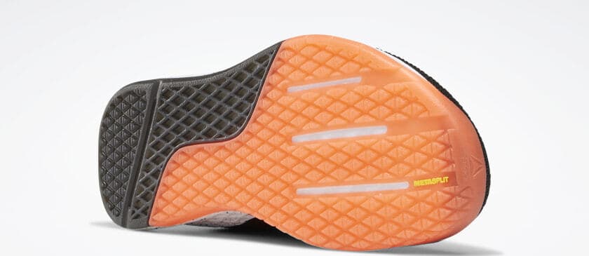 Outsole closeup of the Reebok Nano 9 Men's CrossFit Training Shoe in Black/White/Vivid Orange