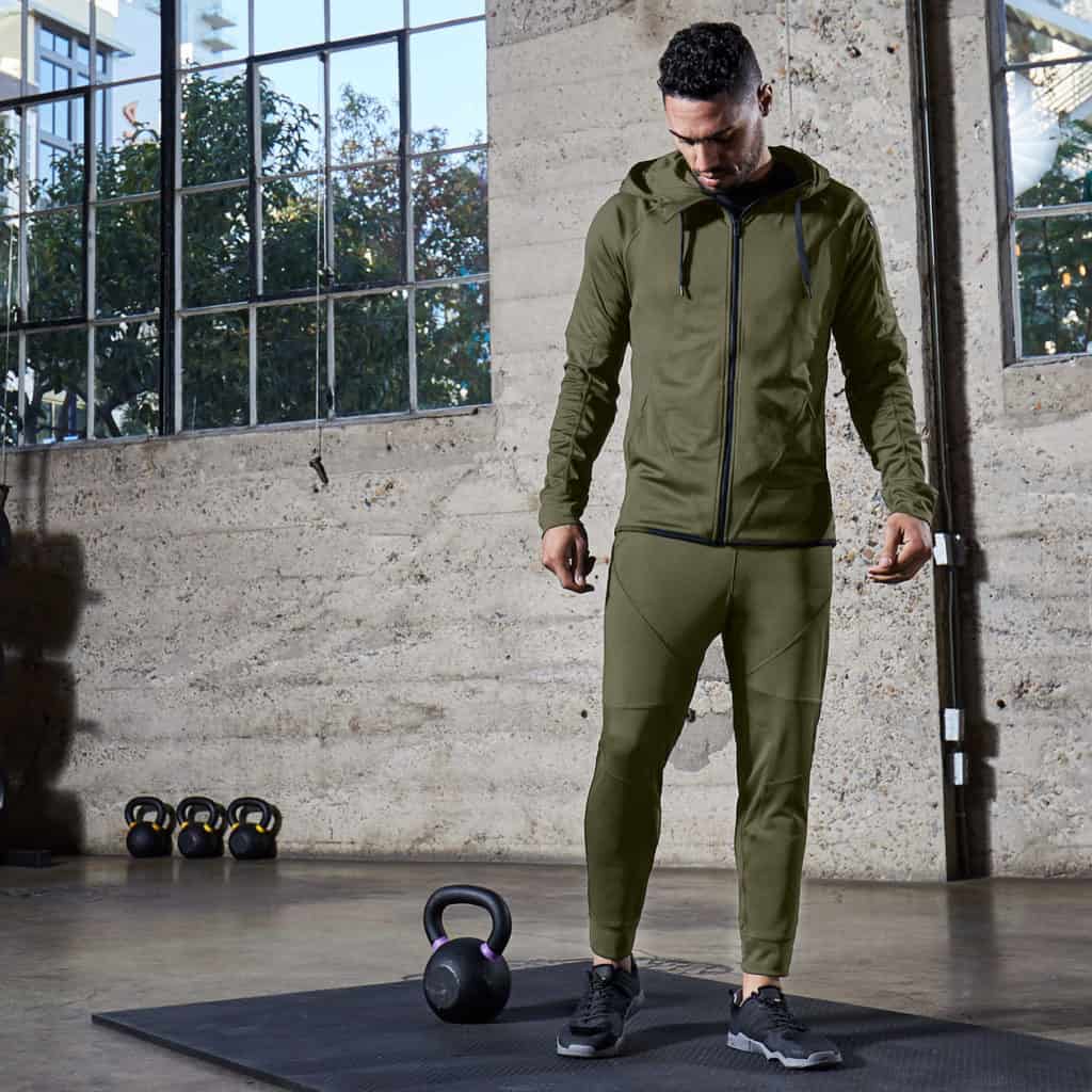 In the gym with Hylete Flexion Workout Pants for Men in Heather Olive