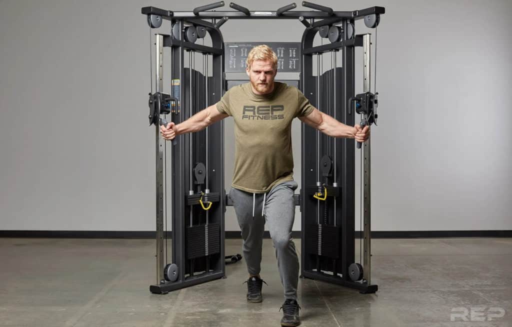 Rep Fitness REP FT-5000 Functional Trainer with a user