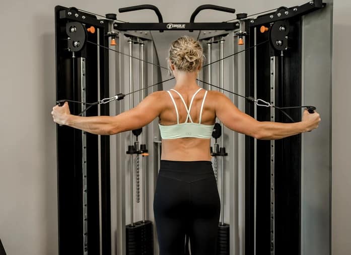 Torque Fitness F9 Fold-Away Functional Trainer with a user