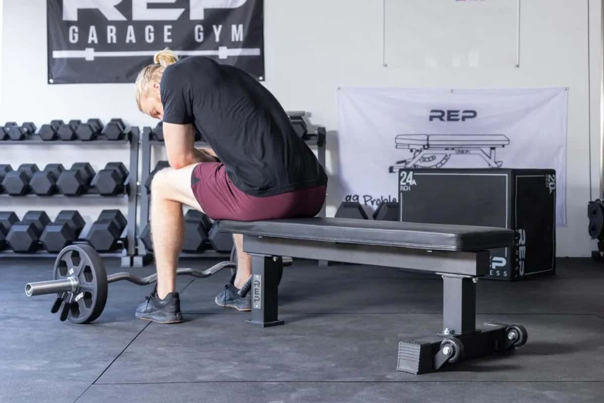 Rep Fitness FB-4000 Comp Lite Bench with a user 1