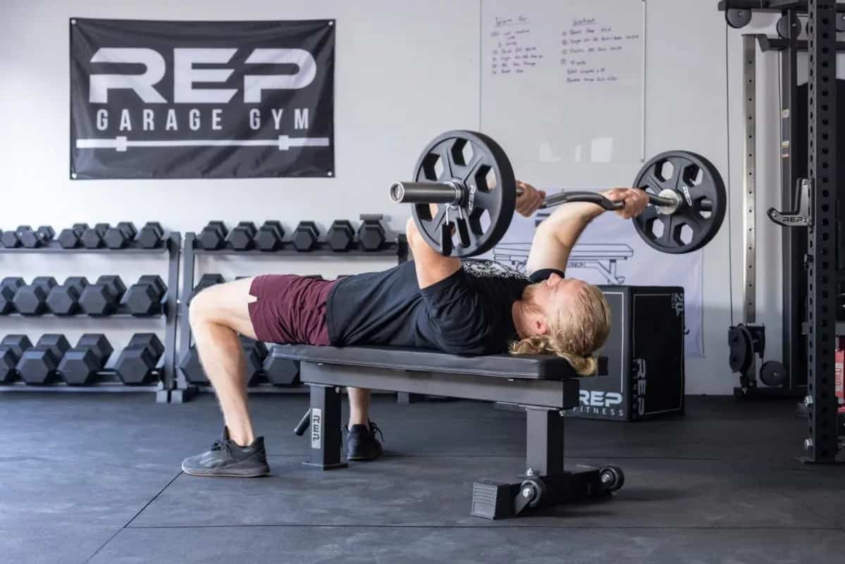 Rep Fitness FB-4000 Comp Lite Bench with a user 2