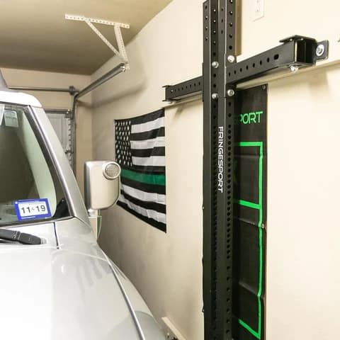 Fringe Sport Retractable Power Rack attached to the wall