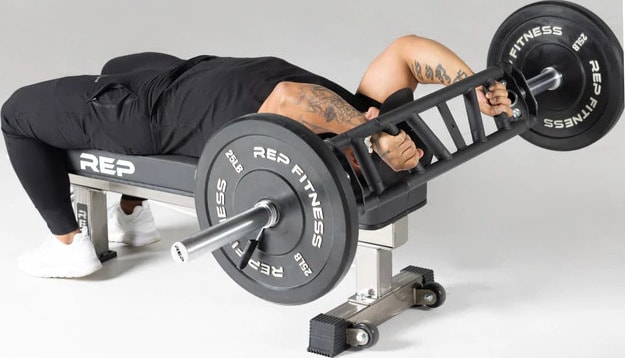 Rep Fitness Cambered Swiss Bar with a user 6