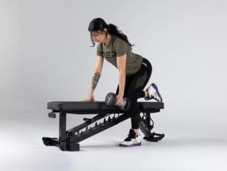 Rep Fitness Rep AB-4100 Adjustable Weight Bench black with an atlete 5