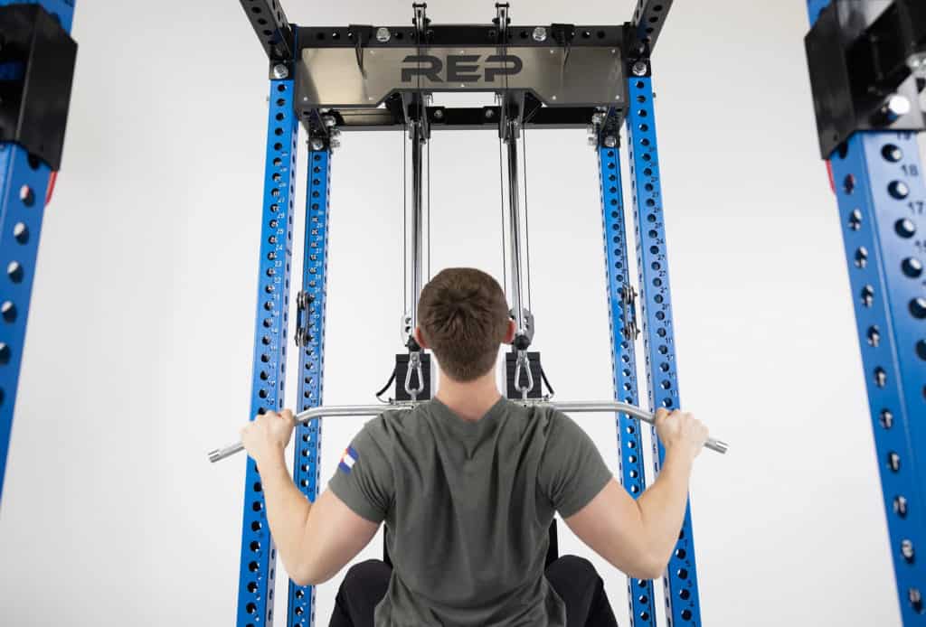 Rep Fitness Ares Cable Attachment (6-Post Series Pre-Order) with an athlete 1