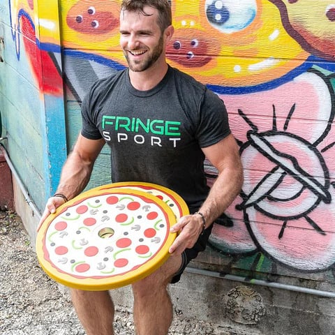 Fringe Sport Pizza Bumper Plates with an athlete 2