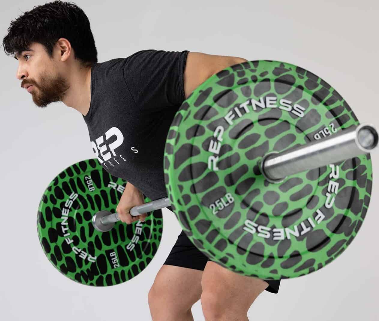 Rep Fitness Animal Print Bumper Plates with an athlete 2