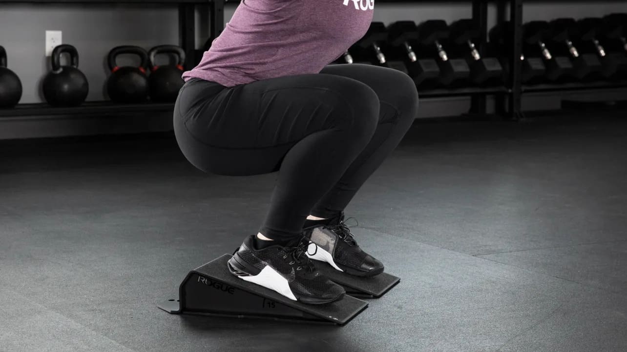 Rogue Squat Wedge with an athlete 2