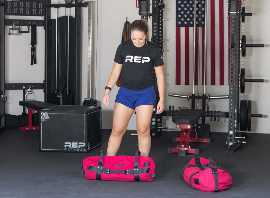 Rep Fitness Sandbags with an athlete