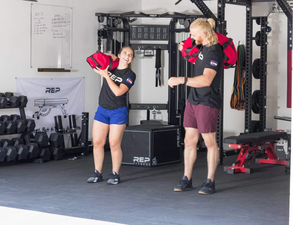 Rep Fitness Sandbags with athletes