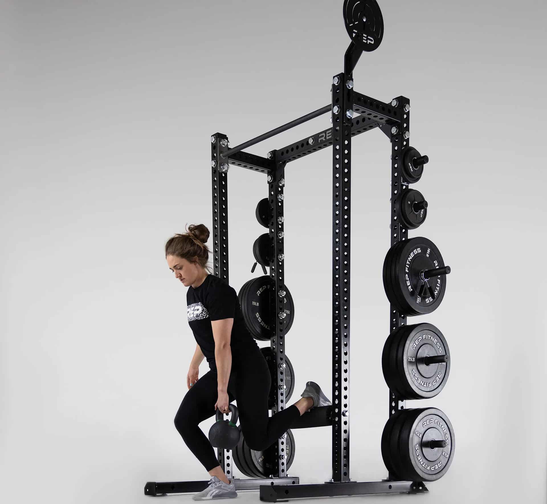 Rep Fitness Apollo Half Rack with an athlete