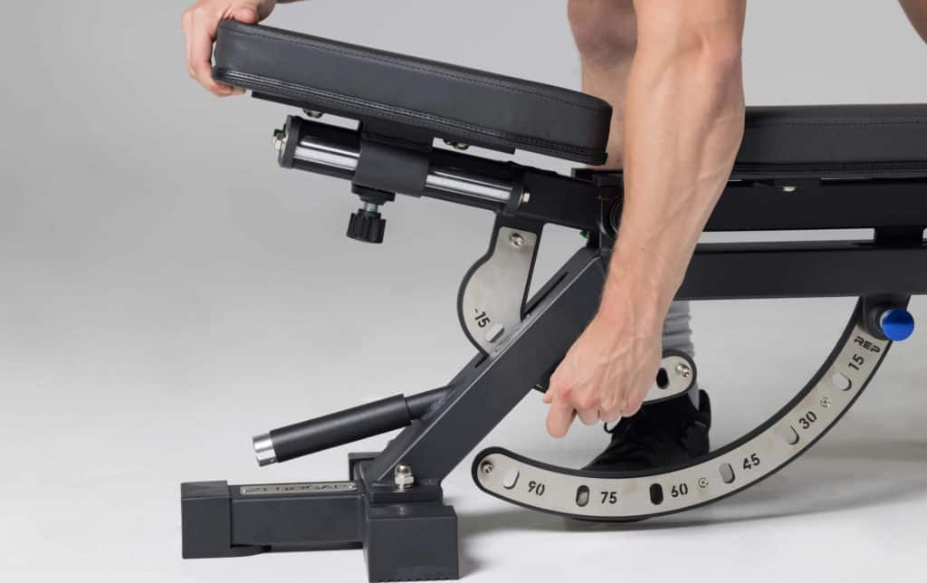 Rep Fitness AB-5000 Zero Gap Adjustable Bench with an athlete 4