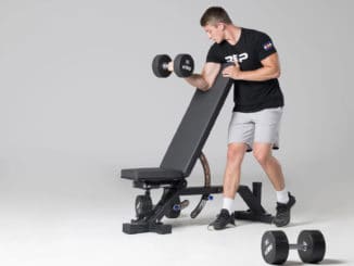 Rep Fitness AB-5000 Zero Gap Adjustable Bench with an athlete 8