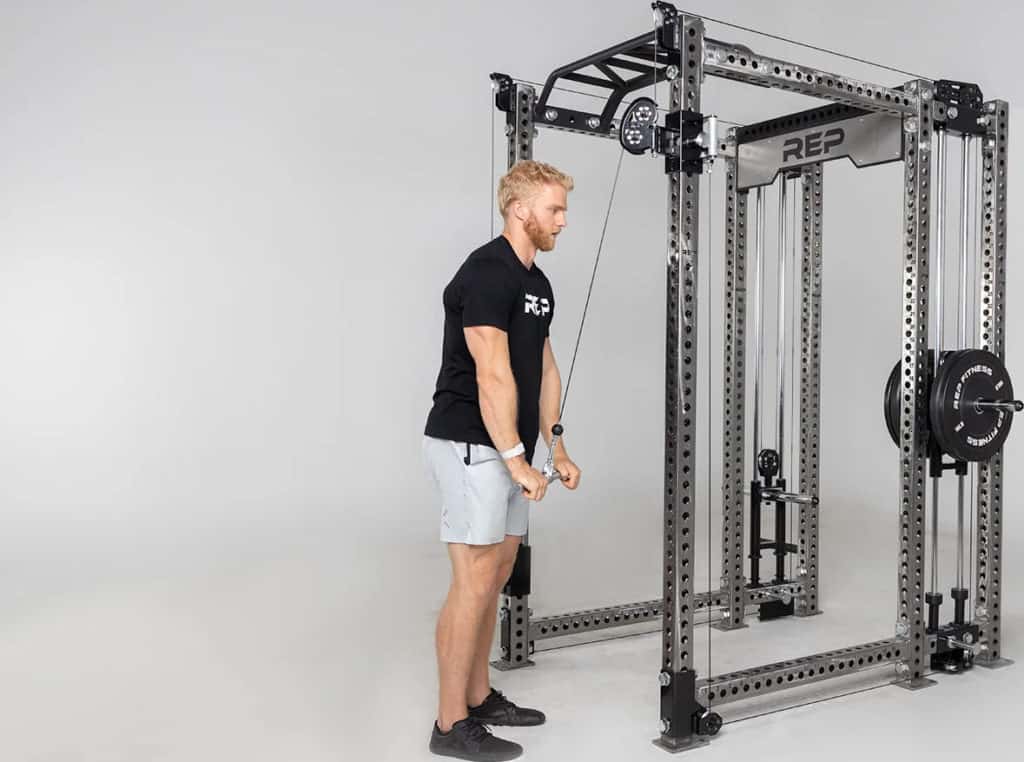 Rep Fitness Athena Plate-Loaded Side-Mount Functional Trainer with an athlete 4