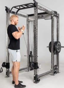 Rep Fitness Athena Plate-Loaded Side-Mount Functional Trainer with an athlete 5
