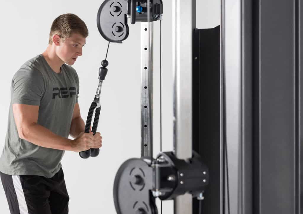 Rep Fitness FT-5000 Functional Trainer with an athlete 3