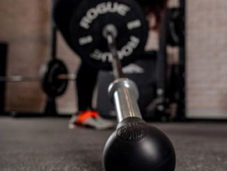 Rogue Fitness AbMat Barbell Bomb with an athlete