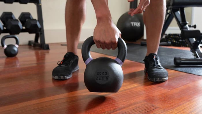 TRX Rubber Coated Kettlebells with an athlete 4