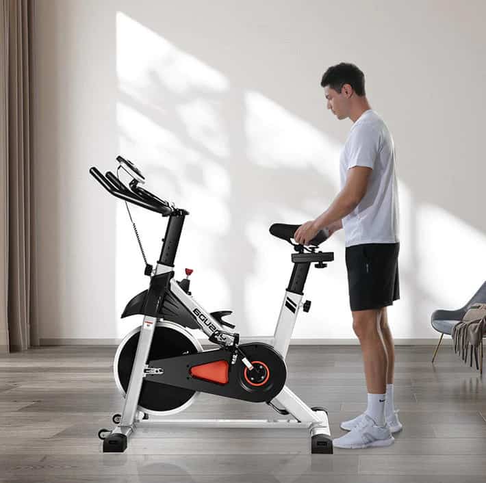 Yosuda YOSUDA Indoor Stationary Cycling Bike YB001 with an athlete