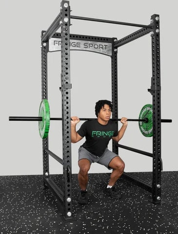 Fringe Sport Osprey Commercial Power Cage (3x3) with an athlete