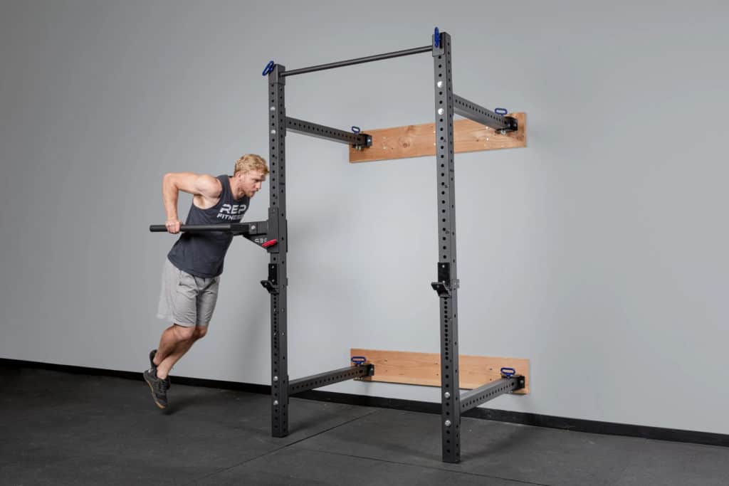 Rep Fitness PR-4100 Folding Squat Rack with an athlete 2