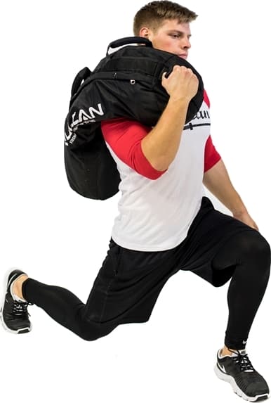 Vulcan Strength Sand Bags with an athlete 2